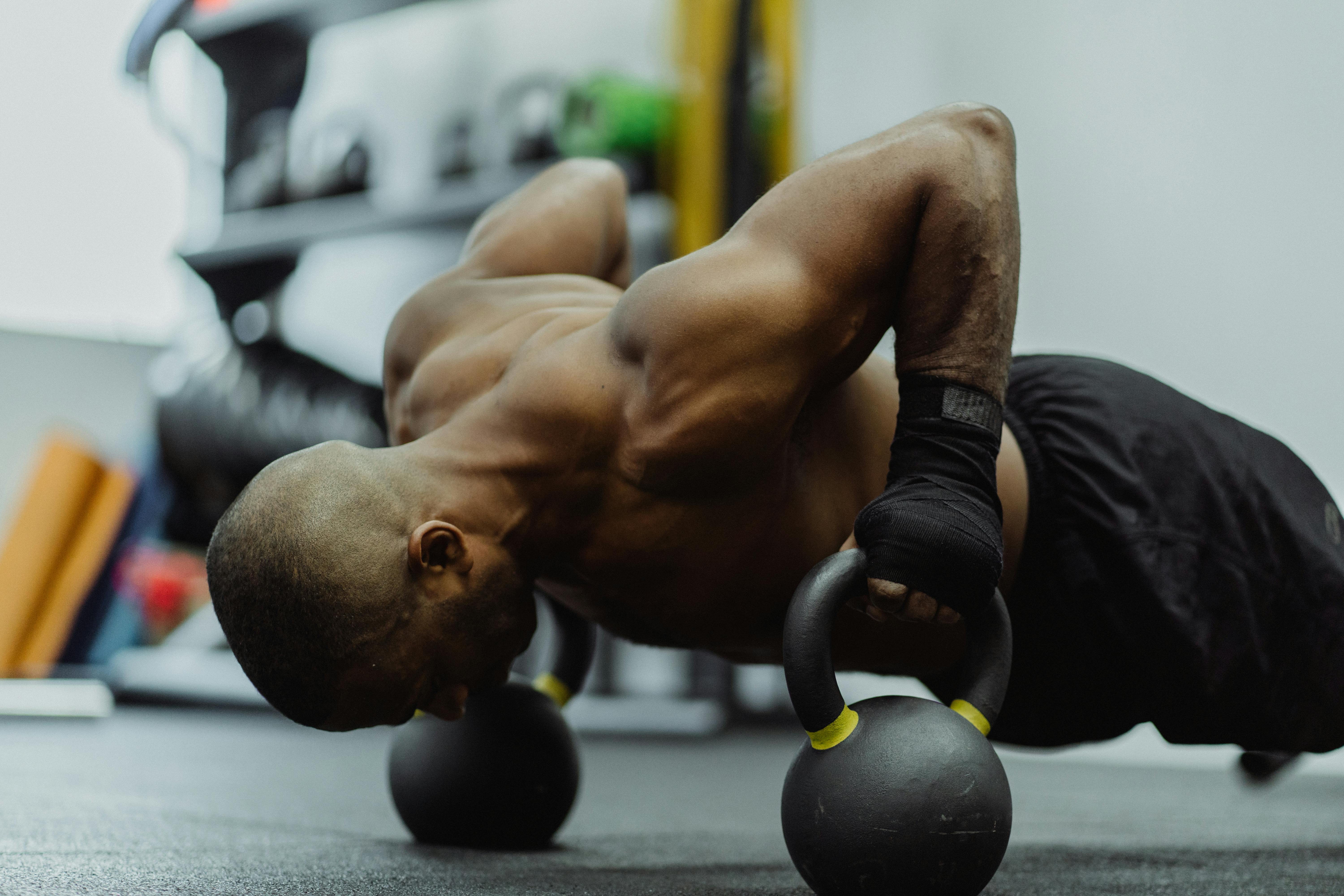 Man Doing Kettle Bell Push-Up, showing how to transform your routine